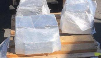 The shipment contained three aluminum blocks, shrink-wrapped and palletized, each weighing approximately 165 pounds.